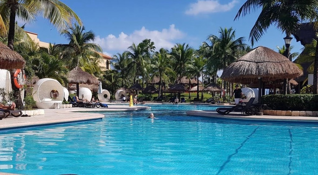 Swimming in one of the pools at Sandos Playacar Beach Resort